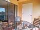 Outdoor patio with sliding glass doors, a ceiling fan and view of a lake at 3001 58Th S Ave # 312, St Petersburg, FL 33712