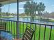 Screened patio with a table and chairs offering views of a lake and fountain at 3001 58Th S Ave # 312, St Petersburg, FL 33712