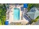 Aerial view of a rectangular swimming pool with ample lounge chairs and shaded areas at 3001 58Th S Ave # 312, St Petersburg, FL 33712