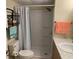 Bathroom with walk-in shower, toilet, and vanity with towel rack, providing a functional and clean space at 36416 Cordova Cir, Zephyrhills, FL 33541