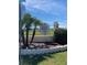 Oaks Royal I & II community entrance with manicured landscaping and mature palm trees on a sunny day at 36416 Cordova Cir, Zephyrhills, FL 33541