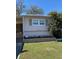 Cozy home with manicured lawn, attractive flower beds, and visible house number at 36416 Cordova Cir, Zephyrhills, FL 33541