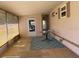 Enclosed porch with tile flooring, blue rug, and windows offering natural light at 36416 Cordova Cir, Zephyrhills, FL 33541