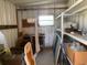 Storage shed interior featuring shelving, work bench, tools, and ample space for organizing at 36416 Cordova Cir, Zephyrhills, FL 33541