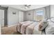 Neutral bedroom features carpet, neutral paint, ceiling fan and window with curtains at 4515 Bent Tree Blvd, Sarasota, FL 34241