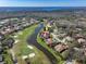 Aerial view featuring the home along a golf course and waterfront at 4906 Turtle Creek Trl, Oldsmar, FL 34677