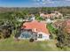 Aerial view of the property with a screened pool and well-maintained landscaping at 4906 Turtle Creek Trl, Oldsmar, FL 34677