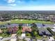 Aerial view highlighting the house's location on a golf course with a lake at 4906 Turtle Creek Trl, Oldsmar, FL 34677
