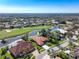 Beautiful home on a golf course community with a lake view and red tile roof at 4906 Turtle Creek Trl, Oldsmar, FL 34677