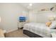 Comfortable bedroom with a TV, ceiling fan, and closet at 4906 Turtle Creek Trl, Oldsmar, FL 34677