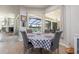 Cozy breakfast nook overlooking the pool area with a checkered tablecloth and cushioned chairs at 4906 Turtle Creek Trl, Oldsmar, FL 34677