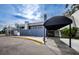 Stylish clubhouse entrance with covered awning, featuring clean lines and elegant design at 4906 Turtle Creek Trl, Oldsmar, FL 34677