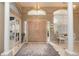 Elegant foyer with high ceilings, arched transom windows and double doors at 4906 Turtle Creek Trl, Oldsmar, FL 34677