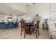 Open-concept living area with kitchen view, breakfast table, and comfortable seating at 4906 Turtle Creek Trl, Oldsmar, FL 34677