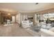 Spacious living room leads to the outdoor patio, dining area, and features comfortable seating at 4906 Turtle Creek Trl, Oldsmar, FL 34677