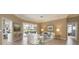 Open concept living room with access to multiple rooms and a view of the outdoor pool area at 4906 Turtle Creek Trl, Oldsmar, FL 34677
