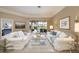 Bright living room with comfortable sofas, glass coffee table, and a view of the pool area at 4906 Turtle Creek Trl, Oldsmar, FL 34677