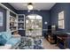 Home office with natural light, a built-in bookshelf, desk, and plenty of space to work at 4906 Turtle Creek Trl, Oldsmar, FL 34677