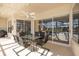 Covered outdoor patio with a dining table, chairs, and view of the backyard at 4906 Turtle Creek Trl, Oldsmar, FL 34677