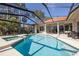Relaxing pool and spa area with a screened enclosure at 4906 Turtle Creek Trl, Oldsmar, FL 34677