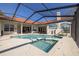 Inviting pool with a connected spa, tile accents, and screened enclosure at 4906 Turtle Creek Trl, Oldsmar, FL 34677