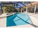 Beautiful pool and spa area with a screened enclosure at 4906 Turtle Creek Trl, Oldsmar, FL 34677