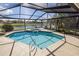 Inviting screened pool area with a spa and scenic water views, perfect for outdoor enjoyment at 4906 Turtle Creek Trl, Oldsmar, FL 34677