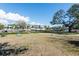 Beautiful waterfront backyard featuring a sprawling lawn, dock, and stunning views of the canal at 4907 W Spring Lake Dr, Tampa, FL 33629