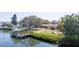 Beautiful waterfront home with a private dock, boat lift, and easy water access at 4907 W Spring Lake Dr, Tampa, FL 33629
