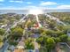 Stunning aerial view of waterfront property with access to the Gulf, lush landscaping, and neighborhood canals at 4911 W Melrose S Ave, Tampa, FL 33629