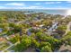 Aerial view of a neighborhood with tree-lined streets, waterfront properties and community canals at 4911 W Melrose S Ave, Tampa, FL 33629