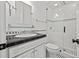 Bathroom featuring black and white tile, glass shower door, modern vanity with sink at 4911 W Melrose S Ave, Tampa, FL 33629