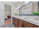 Stylish bathroom with colorful tile accents and double vanity at 4911 W Melrose S Ave, Tampa, FL 33629