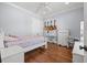Comfortable bedroom with a queen bed and hardwood floors at 4911 W Melrose S Ave, Tampa, FL 33629