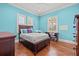 Stylish bedroom with hardwood floors, a large window, and a desk at 4911 W Melrose S Ave, Tampa, FL 33629