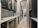 Butler's pantry with wine storage and marble countertops leading to the dining room at 4911 W Melrose S Ave, Tampa, FL 33629