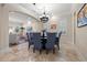 Elegant dining room featuring a round table with seating for eight and a decorative chandelier at 4911 W Melrose S Ave, Tampa, FL 33629