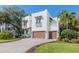 Stunning two-story home with a paver driveway and a two-car garage, blending elegance with functionality at 4911 W Melrose S Ave, Tampa, FL 33629