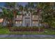 Beautiful exterior elevation showcasing lush landscaping and a classic design at 4911 W Melrose S Ave, Tampa, FL 33629