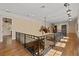 Second story hallway with hardwood floors and iron railing at 4911 W Melrose S Ave, Tampa, FL 33629
