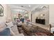 Open-concept living area leading to the dining room with neutral tones and comfortable seating at 4911 W Melrose S Ave, Tampa, FL 33629