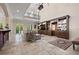 Open living room featuring a built-in entertainment center and second floor balcony at 4911 W Melrose S Ave, Tampa, FL 33629
