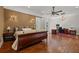 Spacious main bedroom features hardwood floors, a ceiling fan, a desk, and a sitting area at 4911 W Melrose S Ave, Tampa, FL 33629