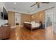 Comfortable main bedroom suite features hardwood floors and ample closet space at 4911 W Melrose S Ave, Tampa, FL 33629