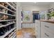This large walk-in closet features custom shoe shelving and built-in organizers at 4911 W Melrose S Ave, Tampa, FL 33629