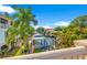 A waterfront view features lush greenery and a boat dock along the canal at 4911 W Melrose S Ave, Tampa, FL 33629