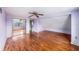This is a bedroom with hardwood floors, large windows, and a large closet at 5105 W Cleveland St, Tampa, FL 33609
