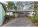 Covered carport and long driveway, offering ample parking space at 5105 W Cleveland St, Tampa, FL 33609