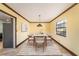 Dining area with contemporary furnishings, neutral tones, and a well-lit atmosphere at 5105 W Cleveland St, Tampa, FL 33609