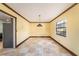 Open dining room space with a large window and room for a big table at 5105 W Cleveland St, Tampa, FL 33609